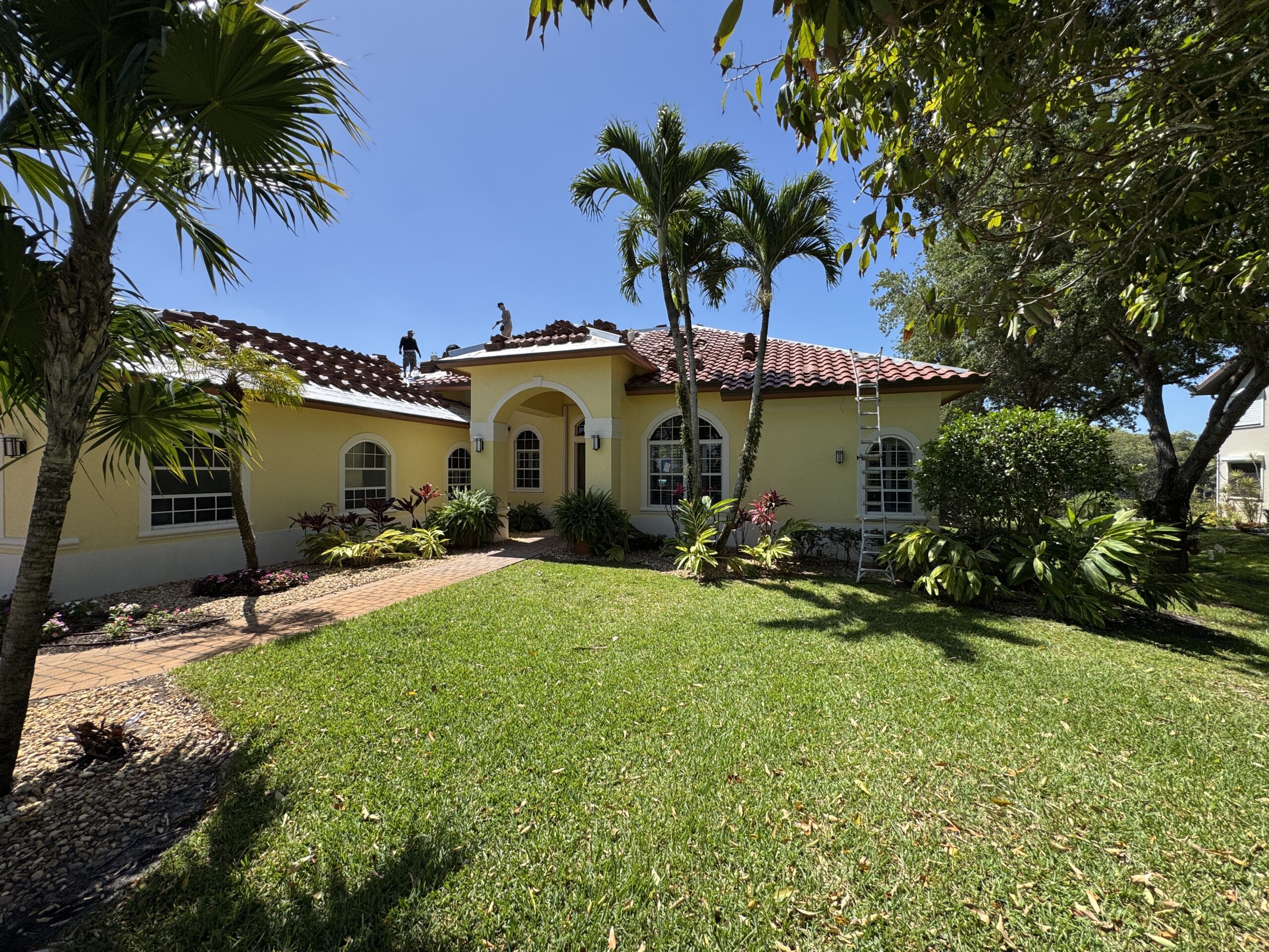 Tile roof installation during a reroof by Salvo & Sons Roofing in Southwest Florida
